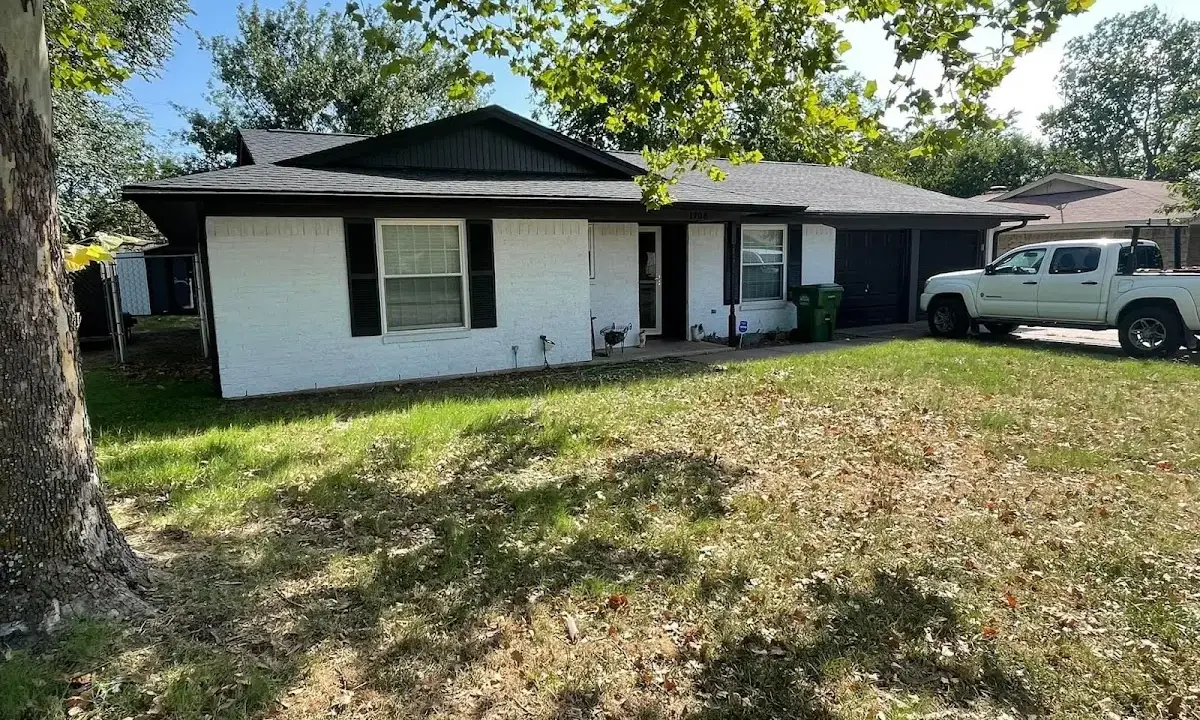 Professional roofing crew working on a residential roof in Fort Rucker